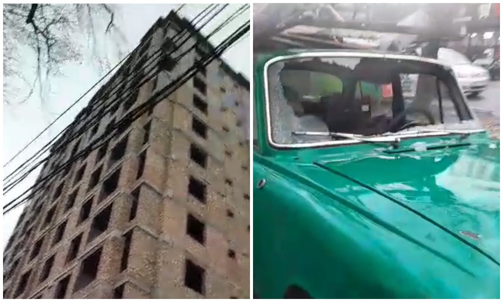 С дома, с которым воюют жители "Байчечекея", слетели кирпичи и разбили автомобиль (видео)